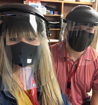 Michael Burke and female wearing shields and masks