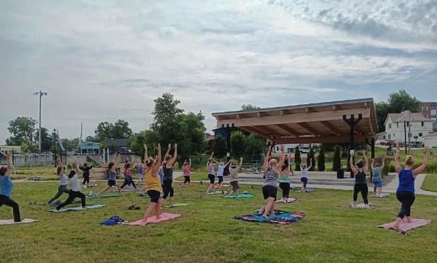 Picture of people doing yoga in a park