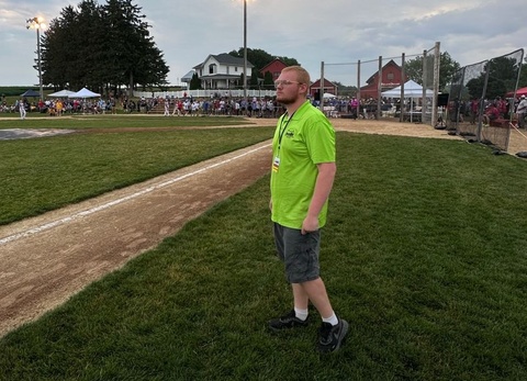 Picture of Clayton Kerch standing in a baseball field 