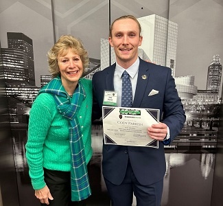 Picture of Cody Parrish receiving an award