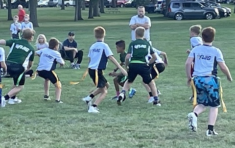 This is a picture of children playing flag football