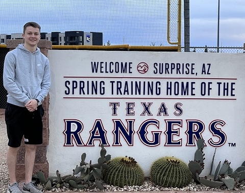 Picture of Reed Zahradnik by the spring training site for the Texas Rangers