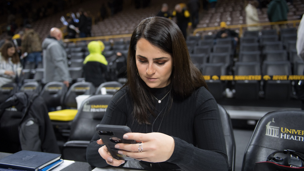 Female using app on her mobile phone