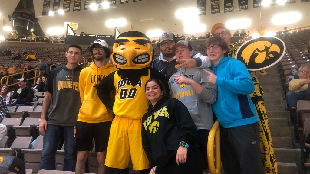 Students with Herky at a game