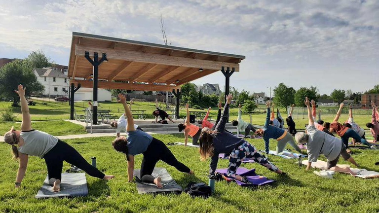 Students doing yoga outside